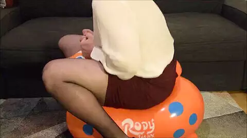 Young crossdresser enjoys a wild ride on his inflatable Rody plaything